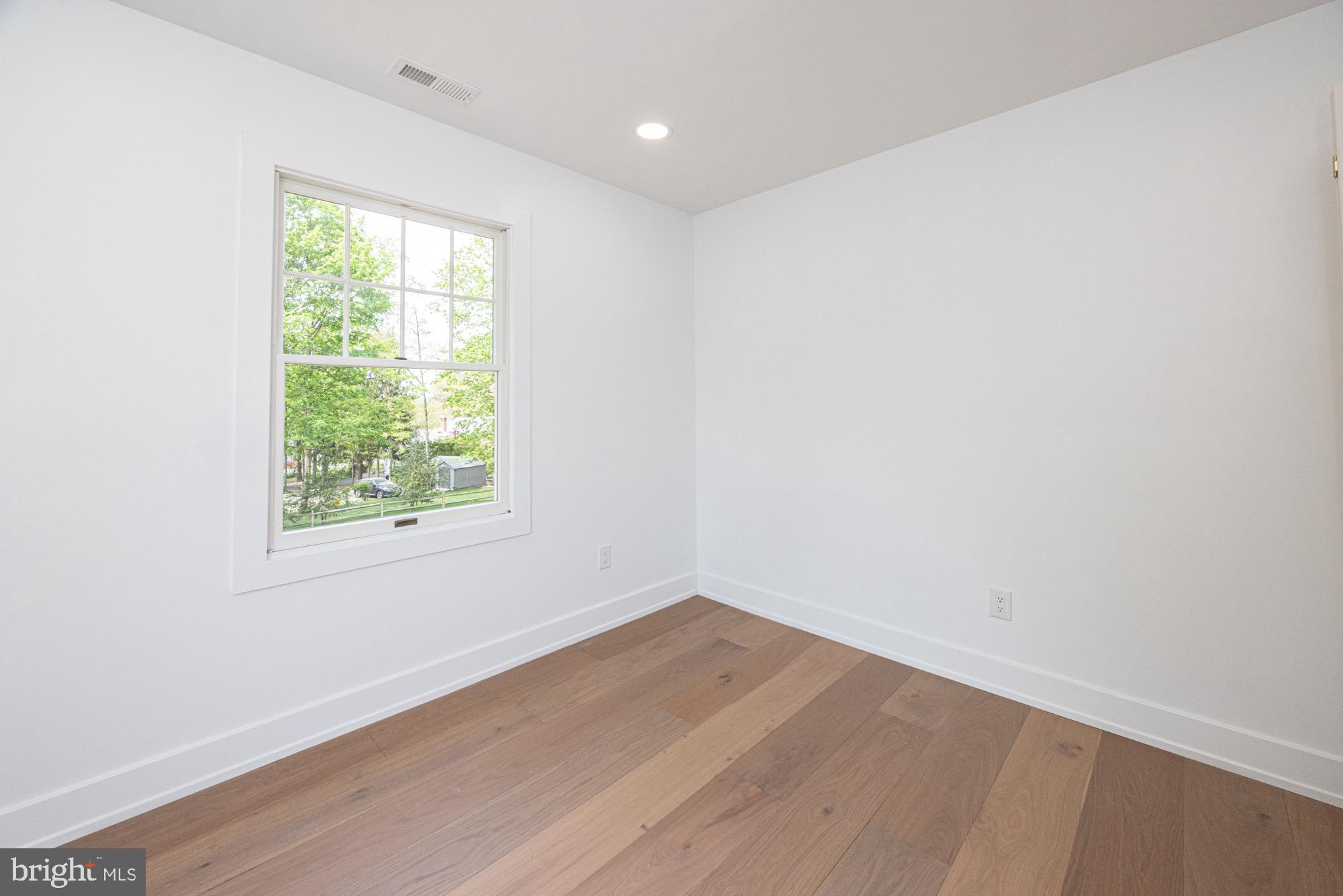 48 Mountainview Court Ewing, NJ 08628 - Photo 27 of 63 an empty room with wooden floor and windows
