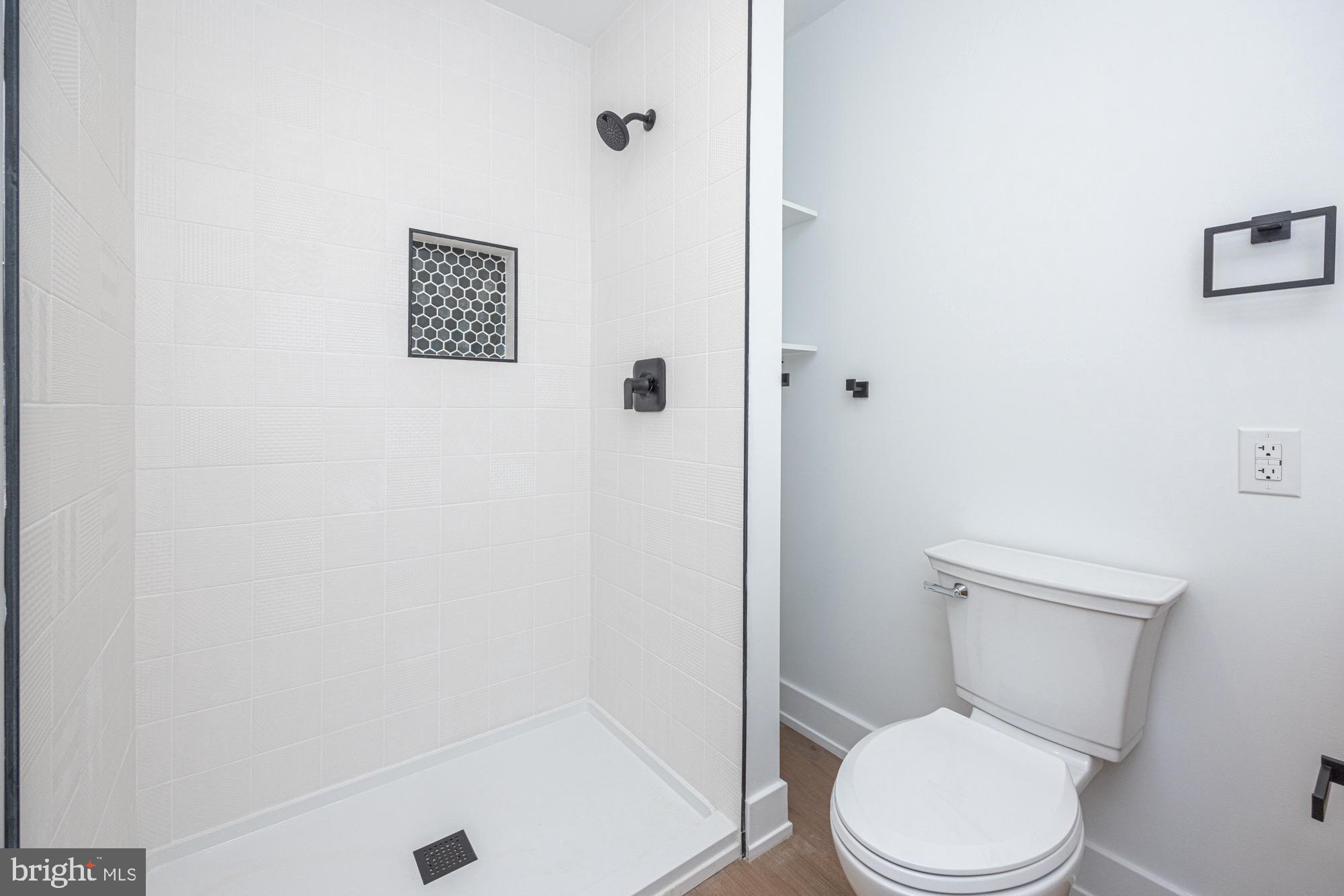 48 Mountainview Court Ewing, NJ 08628 - Photo 30 of 63 a white toilet sitting next to a shower