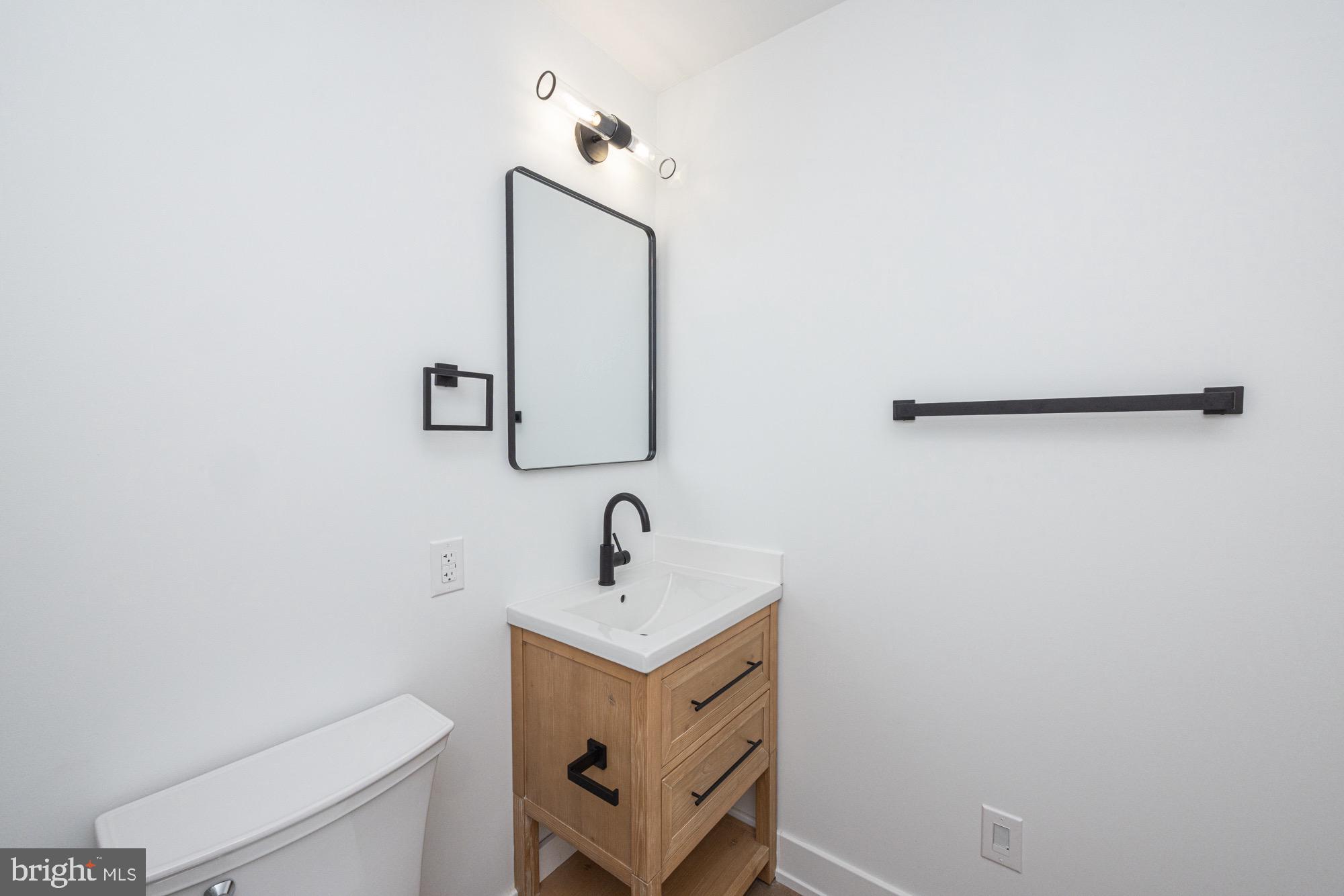 48 Mountainview Court Ewing, NJ 08628 - Photo 31 of 63 a bathroom with a sink and a mirror
