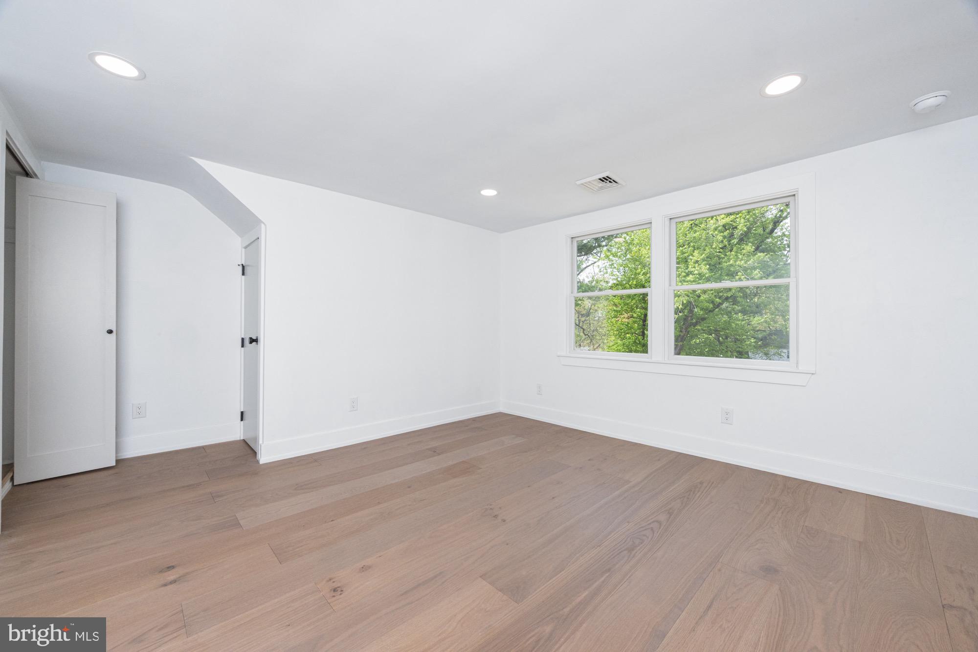 48 Mountainview Court Ewing, NJ 08628 - Photo 32 of 63 an empty room with wooden floor and windows