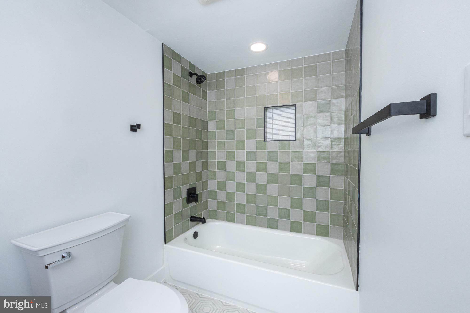 48 Mountainview Court Ewing, NJ 08628 - Photo 35 of 63 a bathroom with a bathtub shower and toilet
