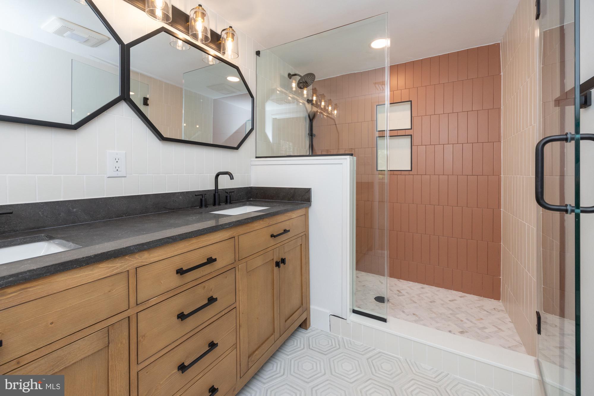 48 Mountainview Court Ewing, NJ 08628 - Photo 39 of 63 a bathroom with a sink a vanity a mirror and shower