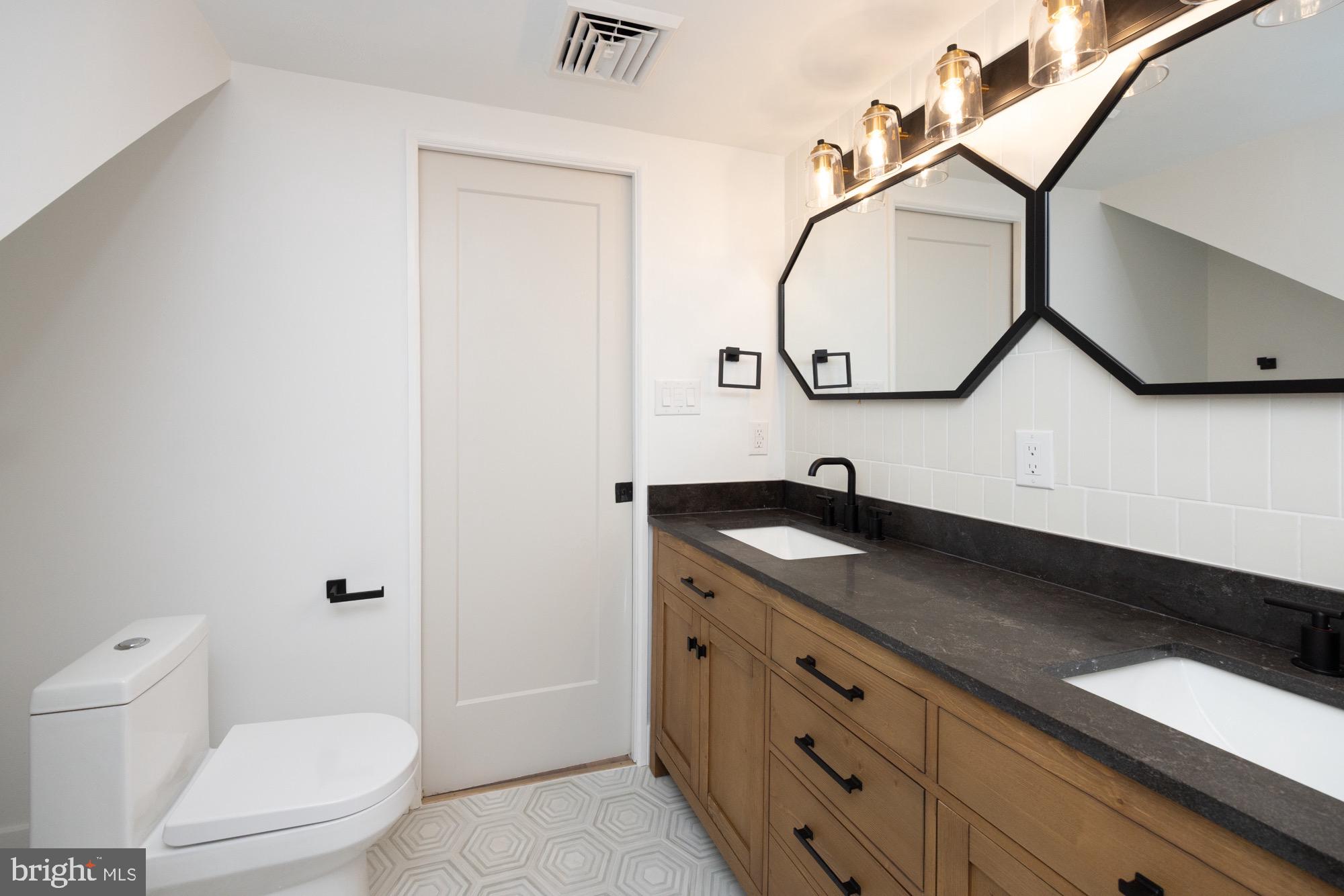 48 Mountainview Court Ewing, NJ 08628 - Photo 40 of 63 a bathroom with a granite countertop sink a toilet and a mirror