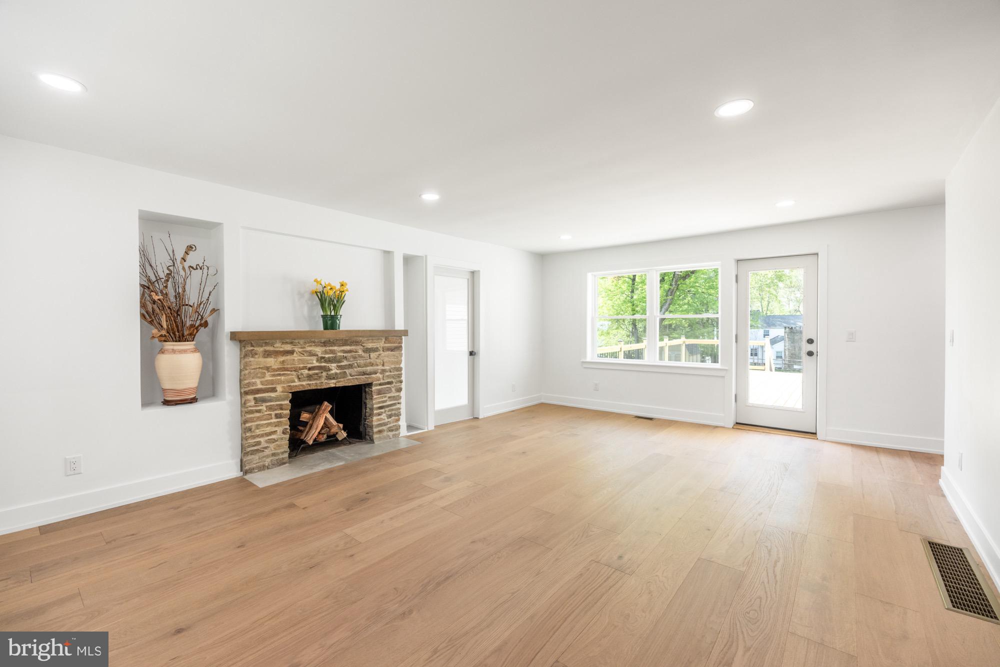 48 Mountainview Court Ewing, NJ 08628 - Photo 4 of 63 a view of an empty room with a fireplace and a window
