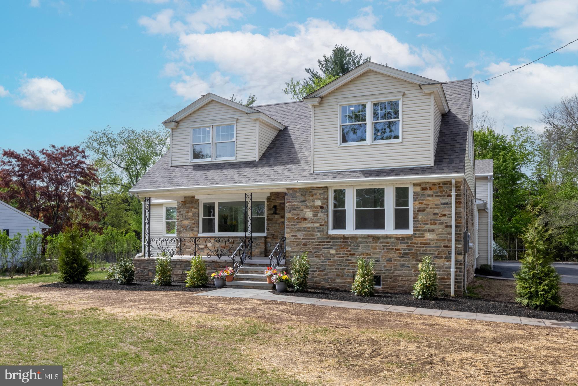 48 Mountainview Court Ewing, NJ 08628 - Photo 51 of 63 a front view of a house with a yard and garage