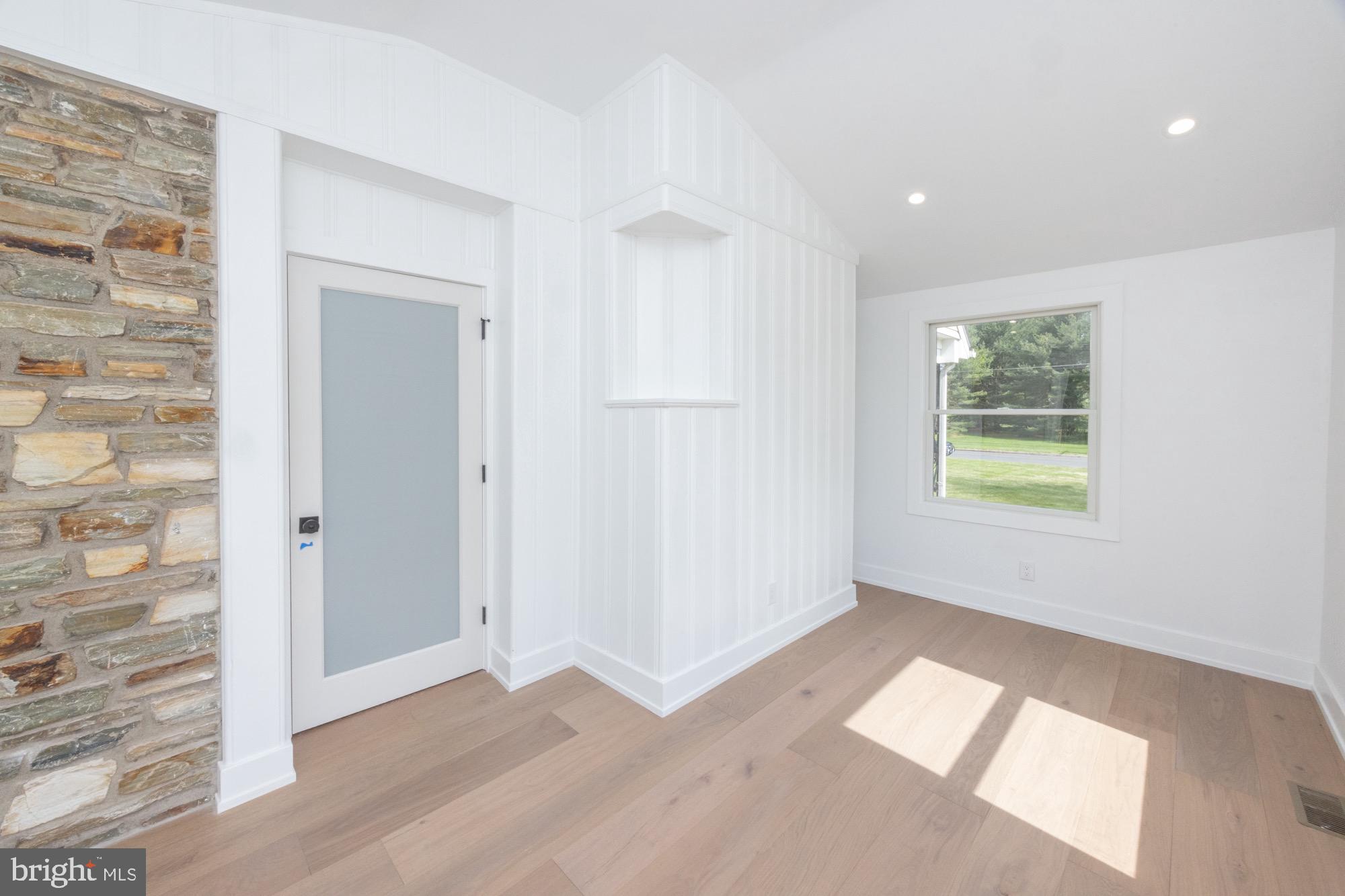 48 Mountainview Court Ewing, NJ 08628 - Photo 8 of 63 wooden floor in an empty room with a window