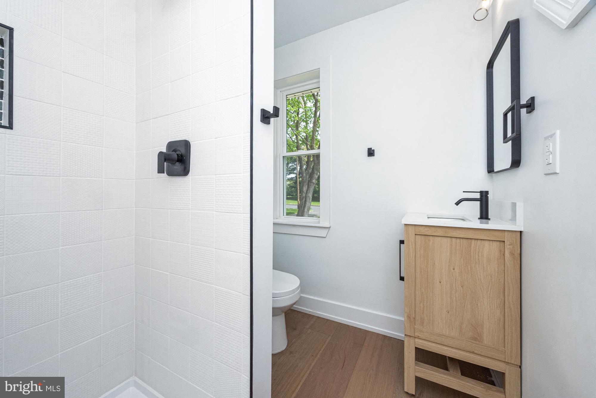 48 Mountainview Court Ewing, NJ 08628 - Photo 10 of 63 a bathroom with a sink and a mirror