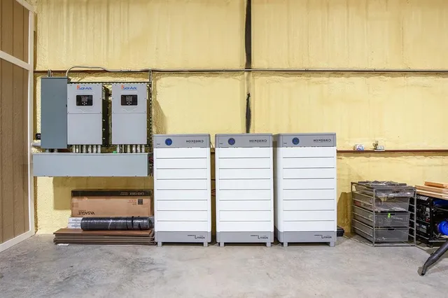 a view of a yard with wooden fence