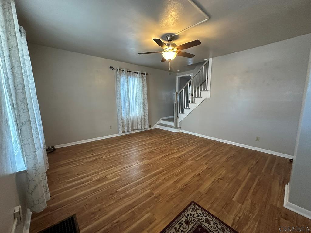 312 12th Street Windber, PA 15963 - Photo 2 of 24 a view of an empty room with wooden floor and a window
