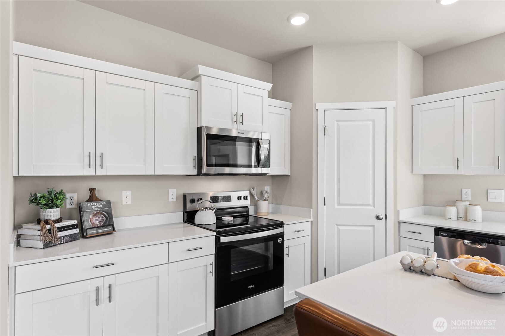 553 Wall Street, Unit 51 Buckley, WA 98321 - Photo 16 of 35 a kitchen with white cabinets and white appliances
