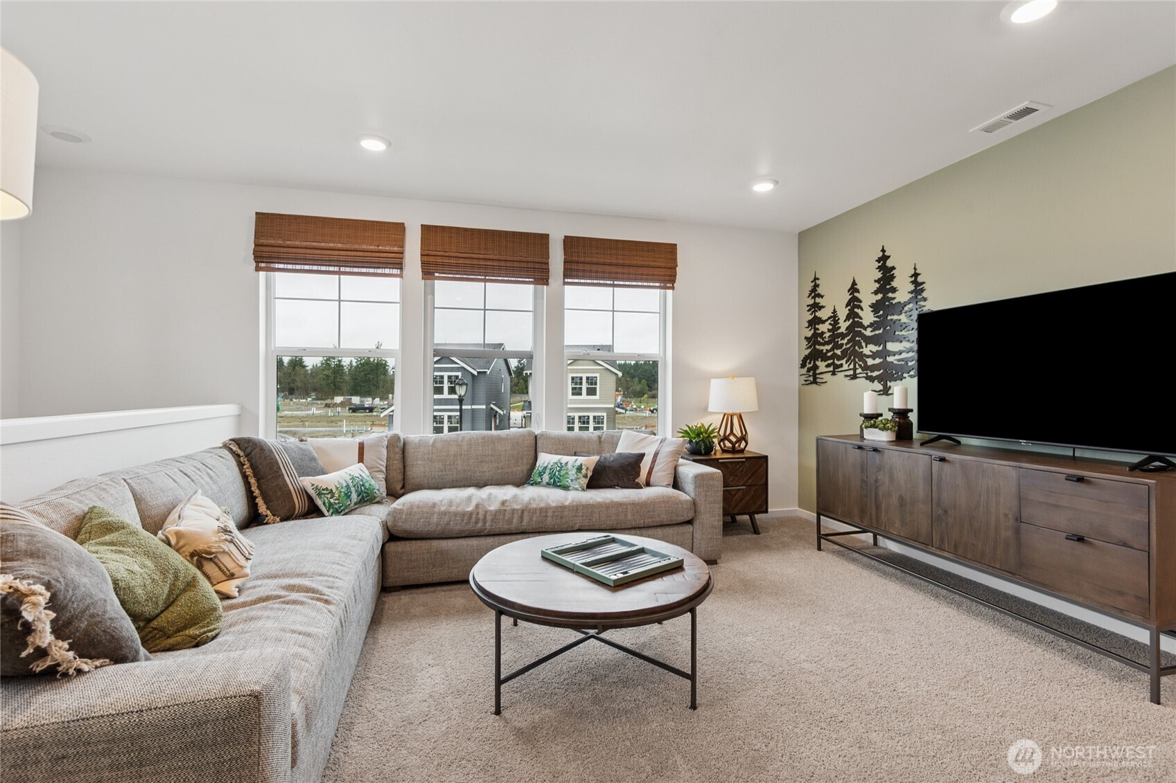 553 Wall Street, Unit 51 Buckley, WA 98321 - Photo 21 of 35 a living room with furniture and a flat screen tv