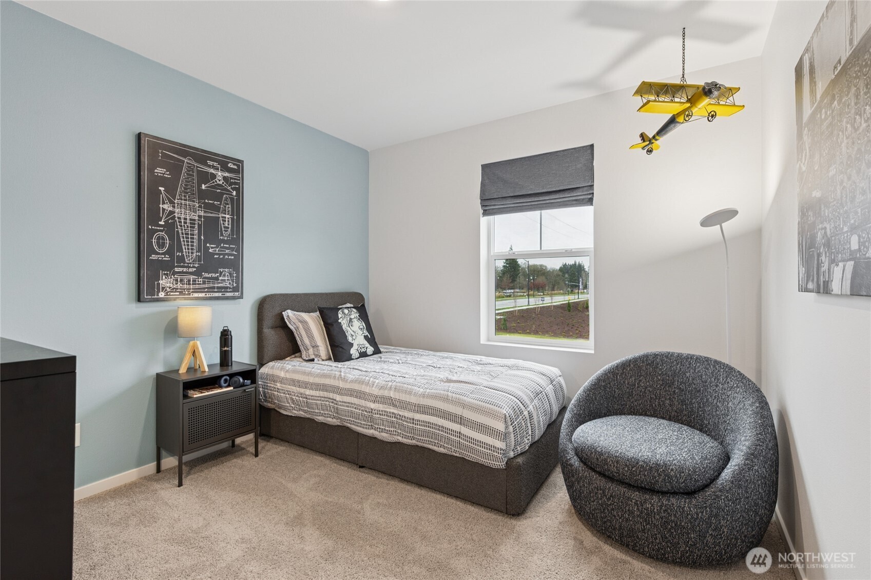 553 Wall Street, Unit 51 Buckley, WA 98321 - Photo 24 of 35 a bedroom with a bed and painting on the wall