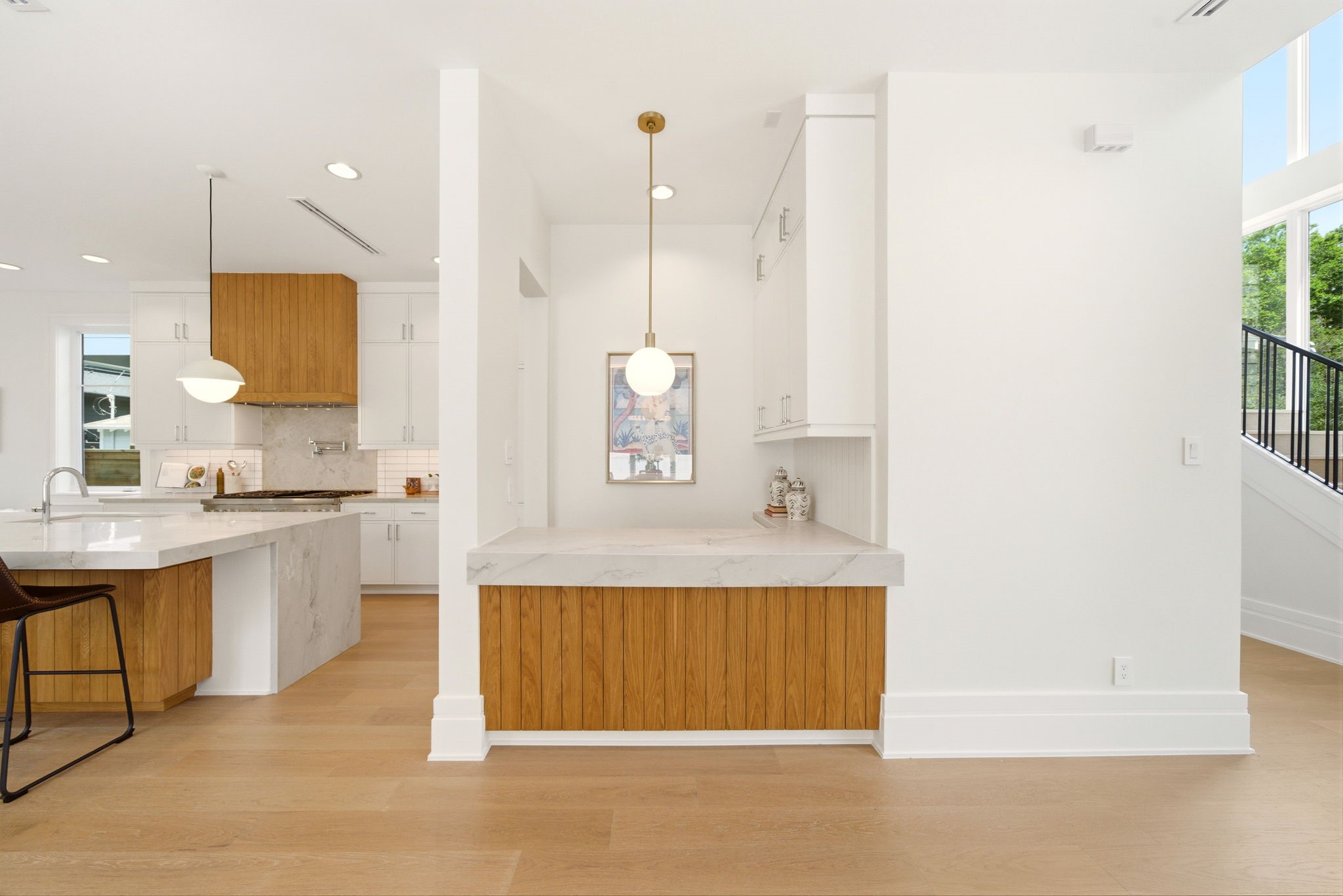 1023 Euclid Street Houston, TX 77009 - Photo 14 of 50 Stylish bar with quartz countertops and custom white oak cabinetry, perfectly positioned for entertaining.