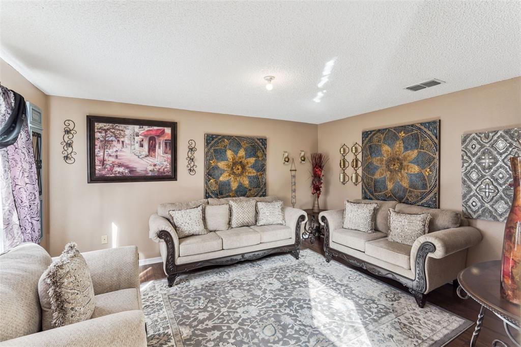 1849 Sunset Ridge Drive Mascotte, FL 34753 - Photo 13 of 29 a living room with furniture and a couch