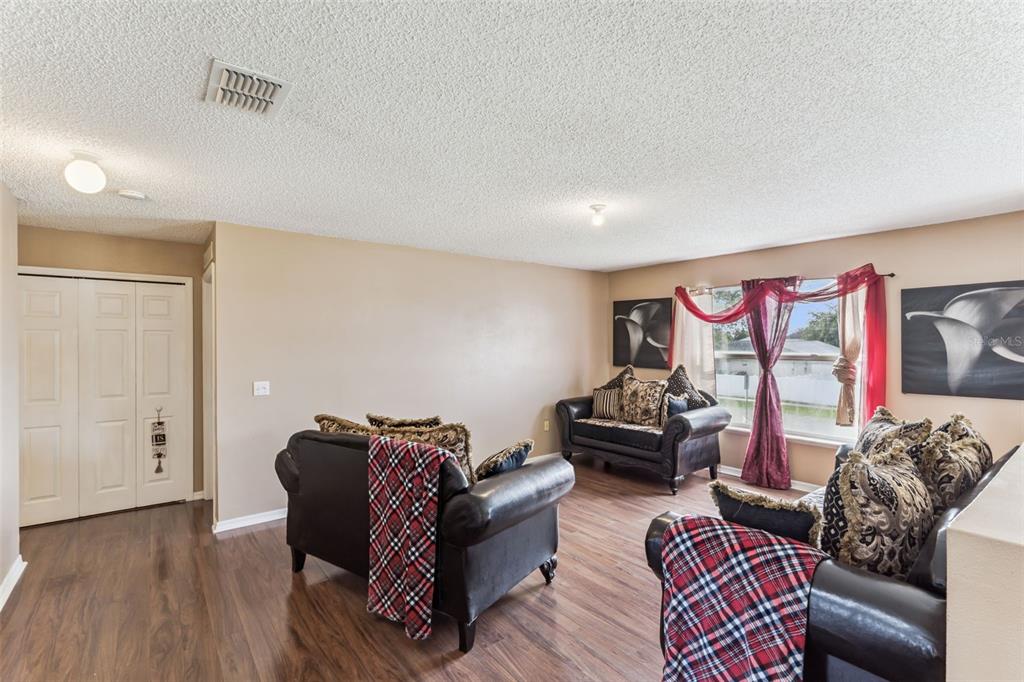 1849 Sunset Ridge Drive Mascotte, FL 34753 - Photo 14 of 29 a living room with furniture and a wooden floor