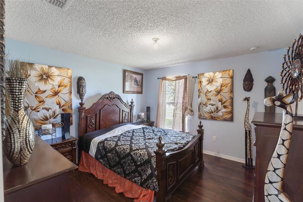 1849 Sunset Ridge Drive Mascotte, FL 34753 - Photo 23 of 29 a bedroom with a large bed and a window