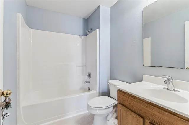 a bathroom with a sink toilet and a bathtub