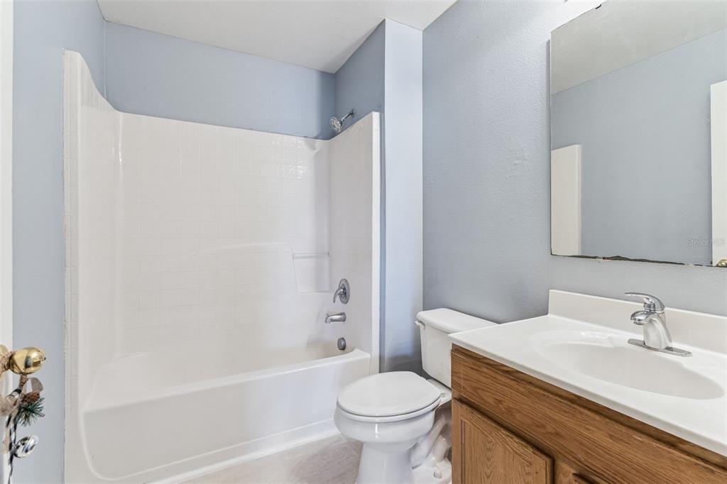 1849 Sunset Ridge Drive Mascotte, FL 34753 - Photo 25 of 29 a bathroom with a sink toilet and a bathtub