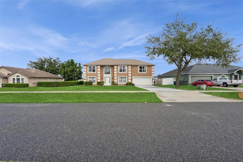 1849 Sunset Ridge Drive Mascotte, FL 34753 - Photo 29 of 29 a view of road with house in background