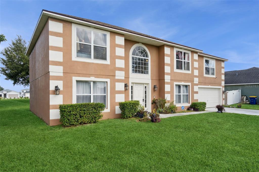 1849 Sunset Ridge Drive Mascotte, FL 34753 - Photo 3 of 29 a front view of a house with a yard