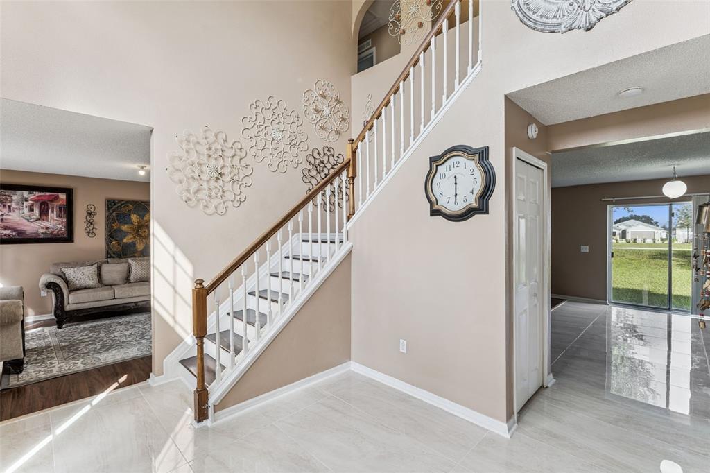 1849 Sunset Ridge Drive Mascotte, FL 34753 - Photo 4 of 29 a view of an entryway with wooden floor