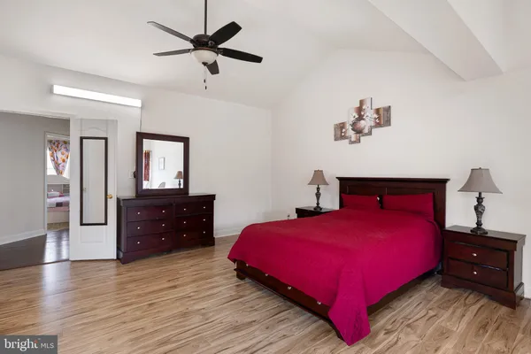 a bedroom with a bed and a dresser