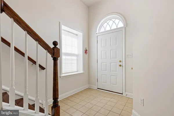 a view of front door with stairs
