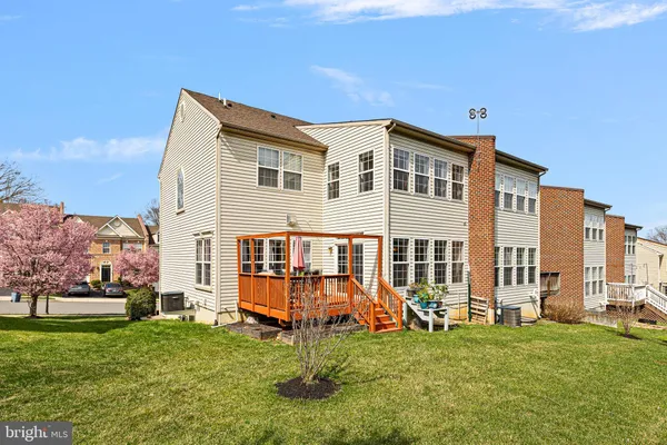 a backyard of a house with barbeque oven
