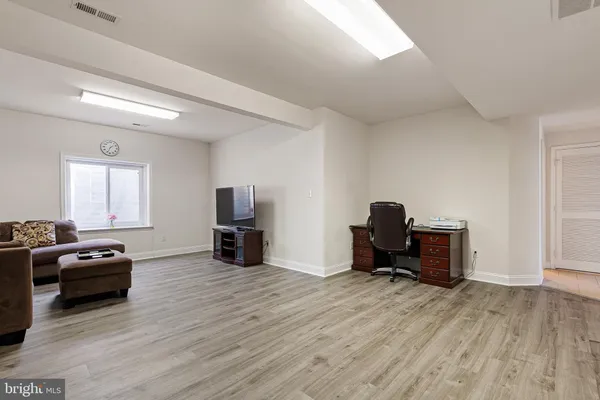 a view of a livingroom with furniture and a flat screen tv