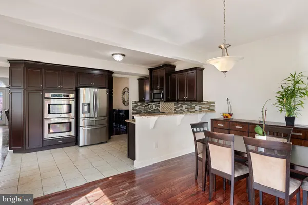 a view of kitchen and dining room with wooden floor