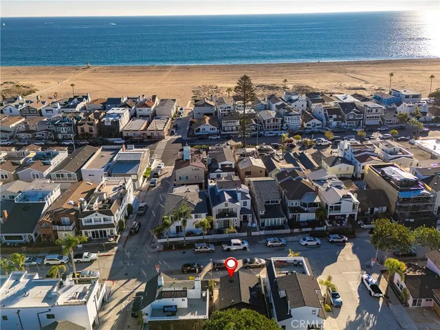 an aerial view of multiple houses with yard