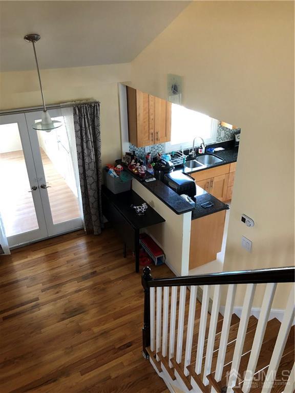 36 Partch Place Edison, NJ 08817 - Photo 12 of 24 a kitchen with stainless steel appliances granite countertop a stove and a wooden floor