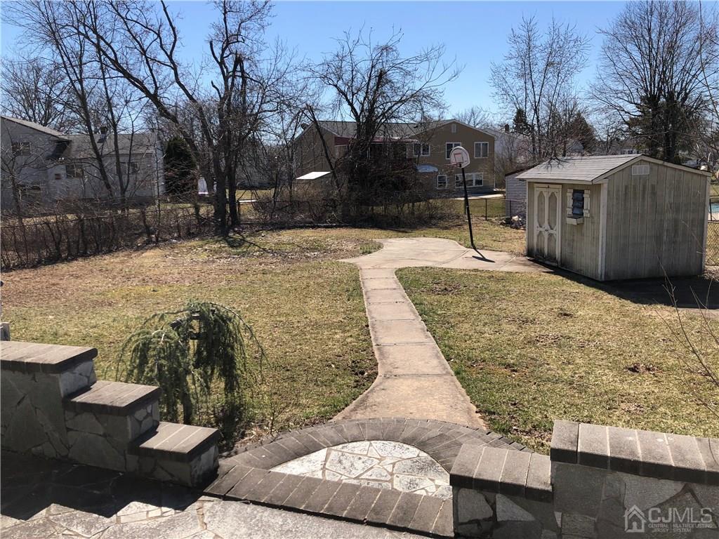 36 Partch Place Edison, NJ 08817 - Photo 20 of 24 a view of a backyard with snow