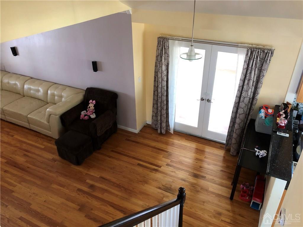 36 Partch Place Edison, NJ 08817 - Photo 8 of 24 a living room with furniture and a flat screen tv