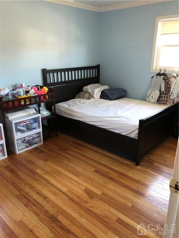 36 Partch Place Edison, NJ 08817 - Photo 10 of 24 a bedroom with a bed and a window