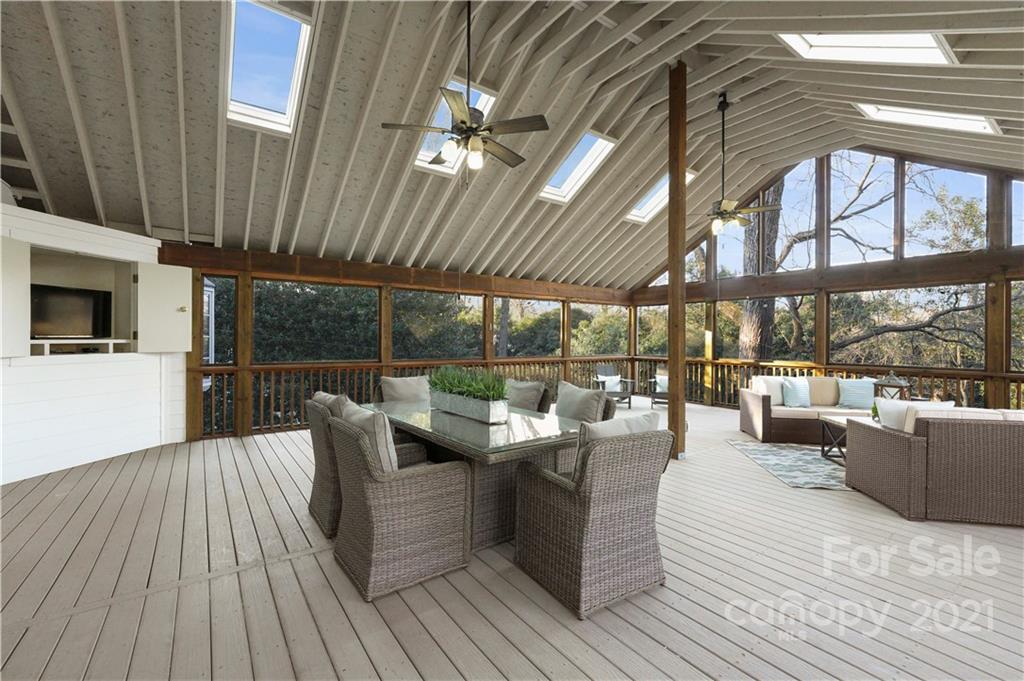 2326 Ferncliff Road Charlotte, NC 28211 - Photo 25 of 48 a view of a roof deck with couches and potted plants