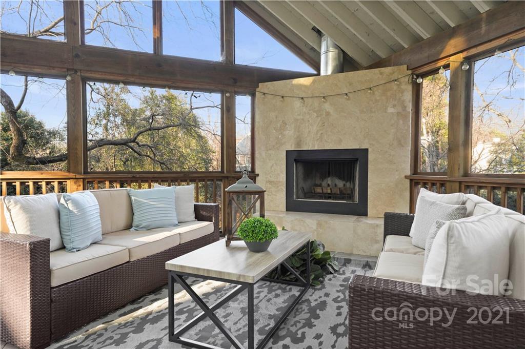 2326 Ferncliff Road Charlotte, NC 28211 - Photo 26 of 48 a living room with furniture a fireplace and a large window