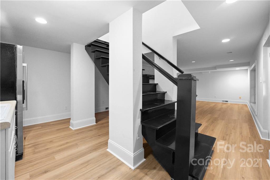 2326 Ferncliff Road Charlotte, NC 28211 - Photo 38 of 48 a view of hallway with stairs and wooden floor