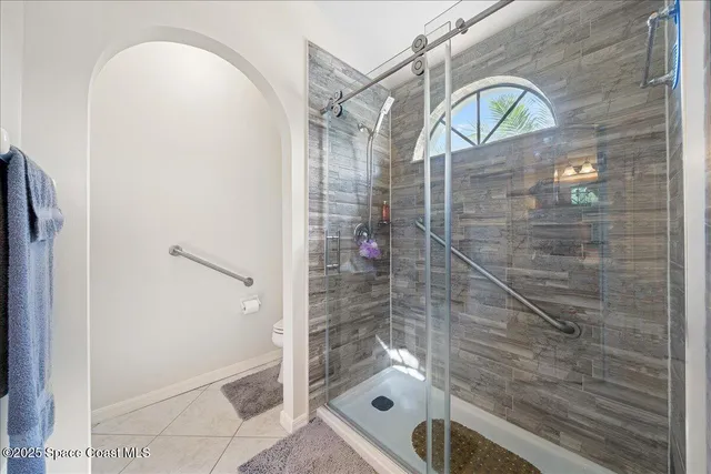 a bathroom with a shower and a sink