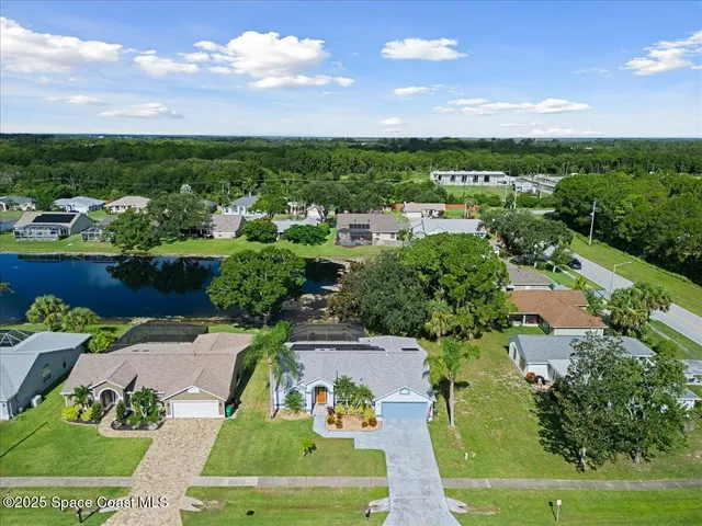an aerial view of a house with a garden