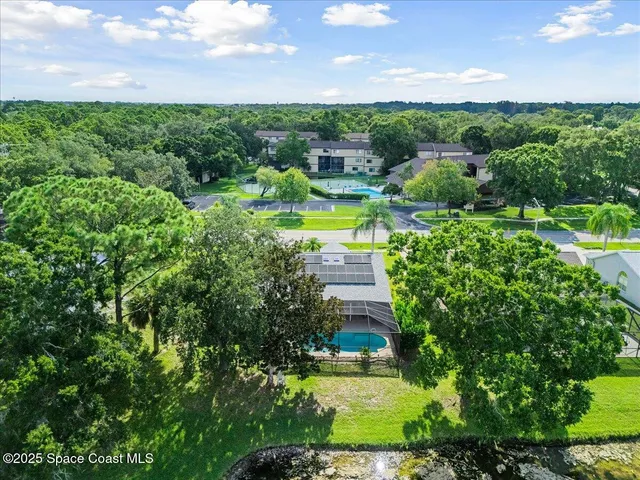 a view of a swimming pool with a yard