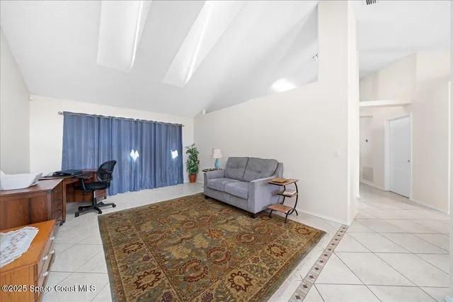 a living room with furniture and a table
