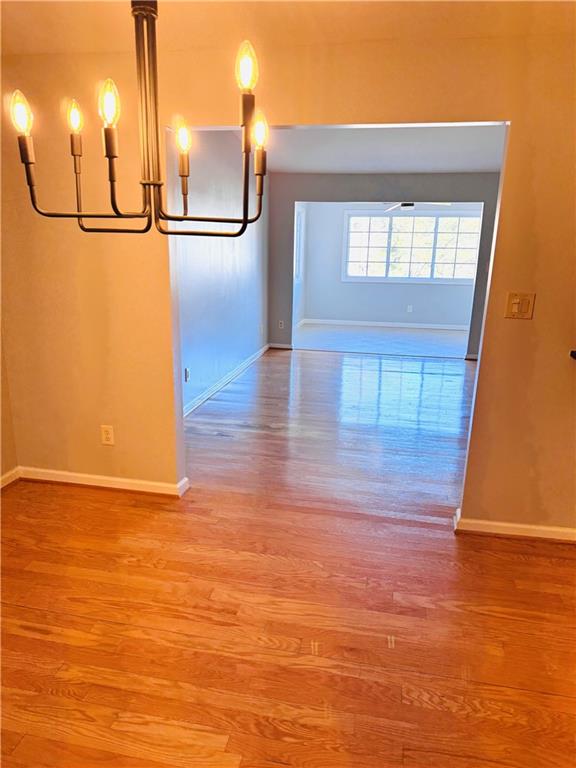 1468 Briarwood Road Northeast, Unit 1008 Atlanta, GA 30319 - Photo 16 of 44 a view of a room with wooden floor and a window