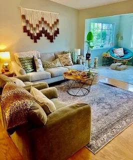 a living room with furniture and a window