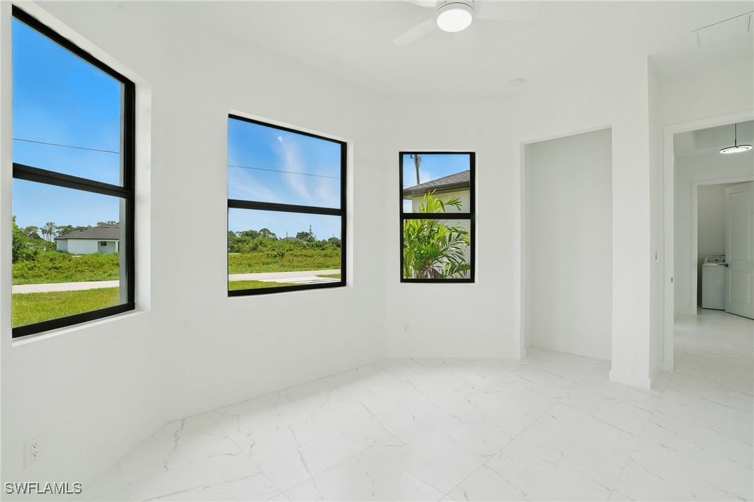 472 Rajah Street Lehigh Acres, FL 33974 - Photo 16 of 29 a view of room with window and tub