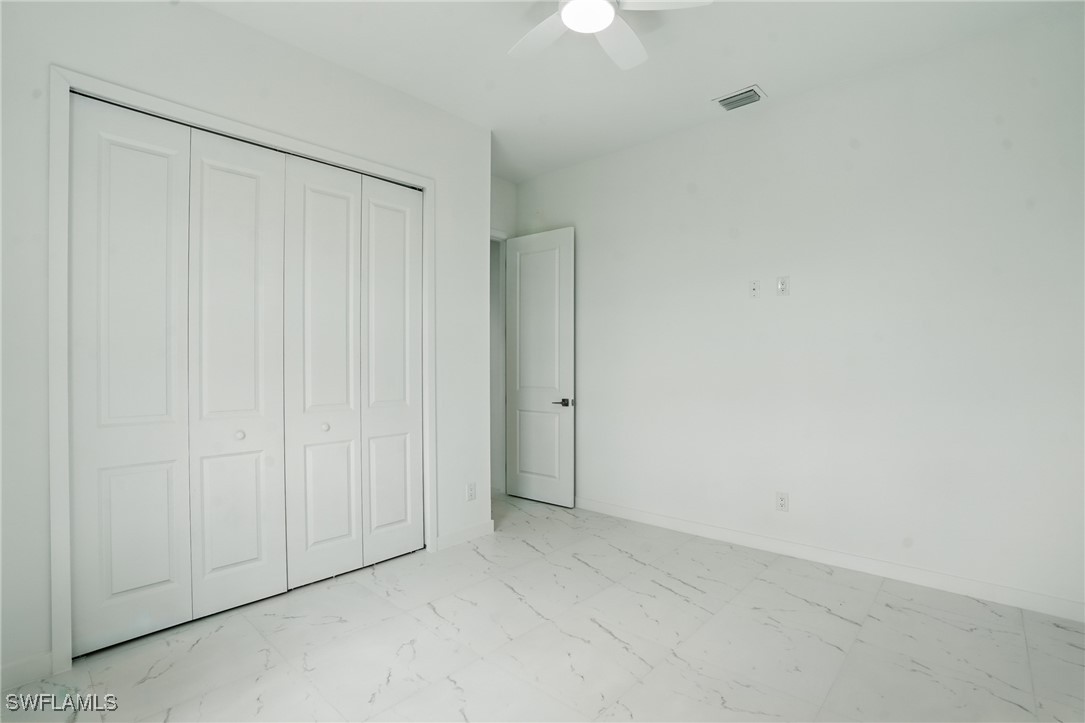 472 Rajah Street Lehigh Acres, FL 33974 - Photo 19 of 29 a view of an empty room