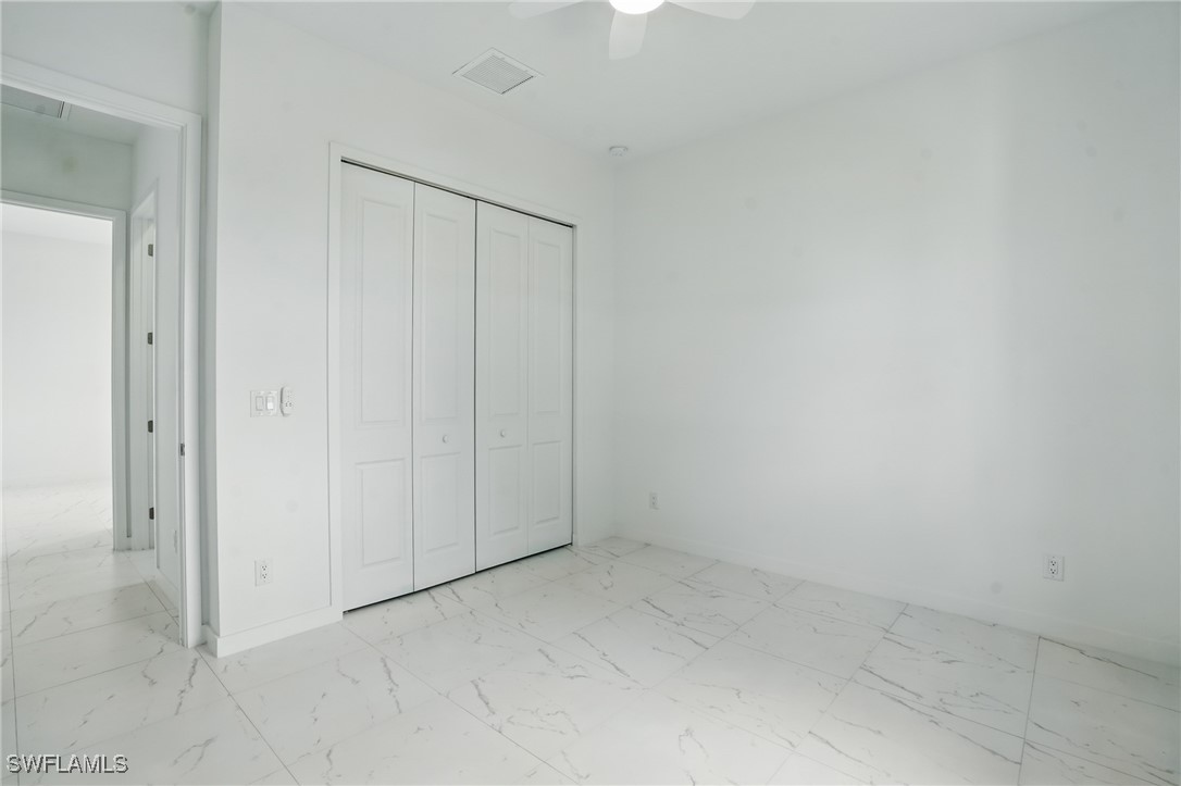 472 Rajah Street Lehigh Acres, FL 33974 - Photo 22 of 29 a view of an empty room