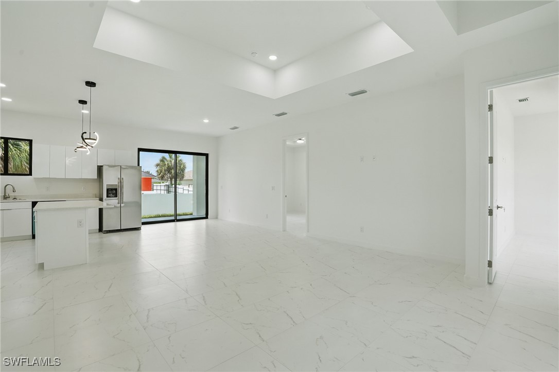 472 Rajah Street Lehigh Acres, FL 33974 - Photo 8 of 29 a view of a kitchen with a sink and a large window