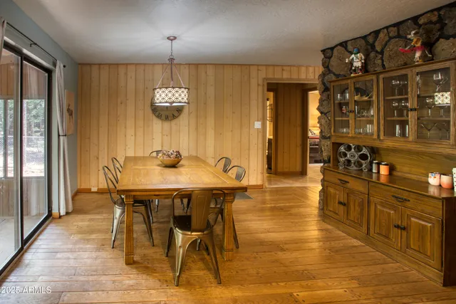 a view of a dining room with furniture and window