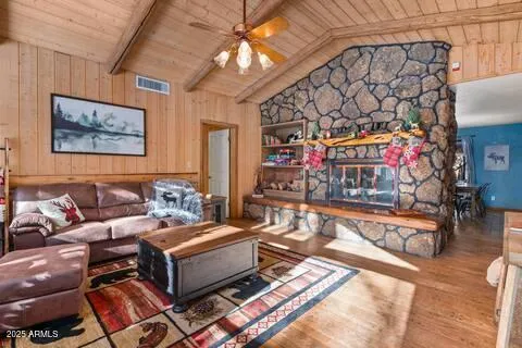 a living room with lots of furniture and a rug